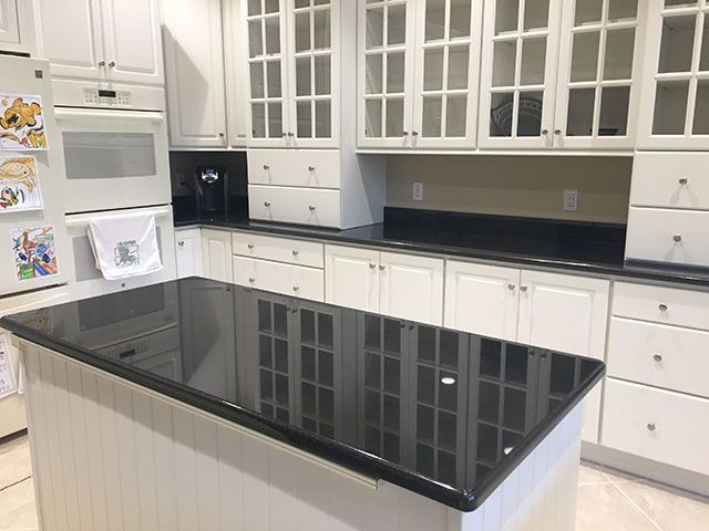 Kitchen Island With A Granite Countertop Absolute-Black--Granite-Island ... in Classic Kitchen Island, Black Granite Top &amp; Large Cabinet With Adjustable Shelf