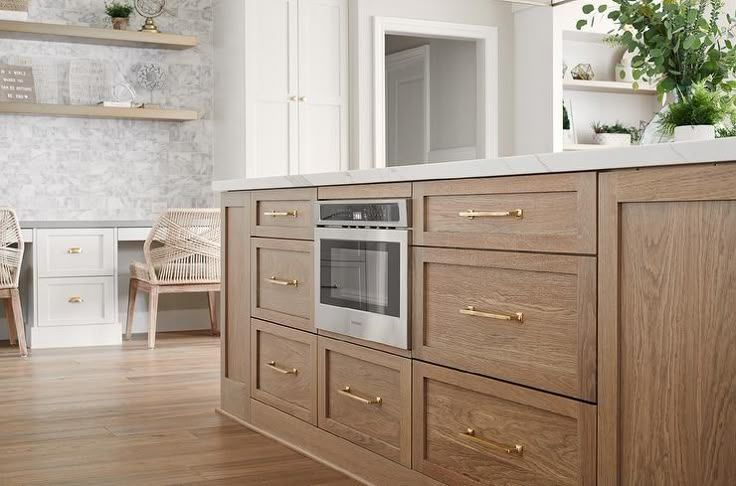 Brushed Brown Oak Kitchen Island With Polished Brass Pulls pertaining to Exploring the Craftsmanship of the Quincy Brown Oak and Brushed Stainless Steel Chest