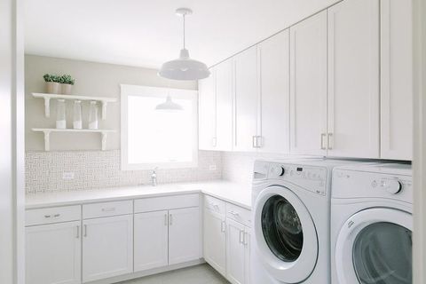 Stunning White Laundry Room Features Stacked White Shelves Mounted On A ... inside