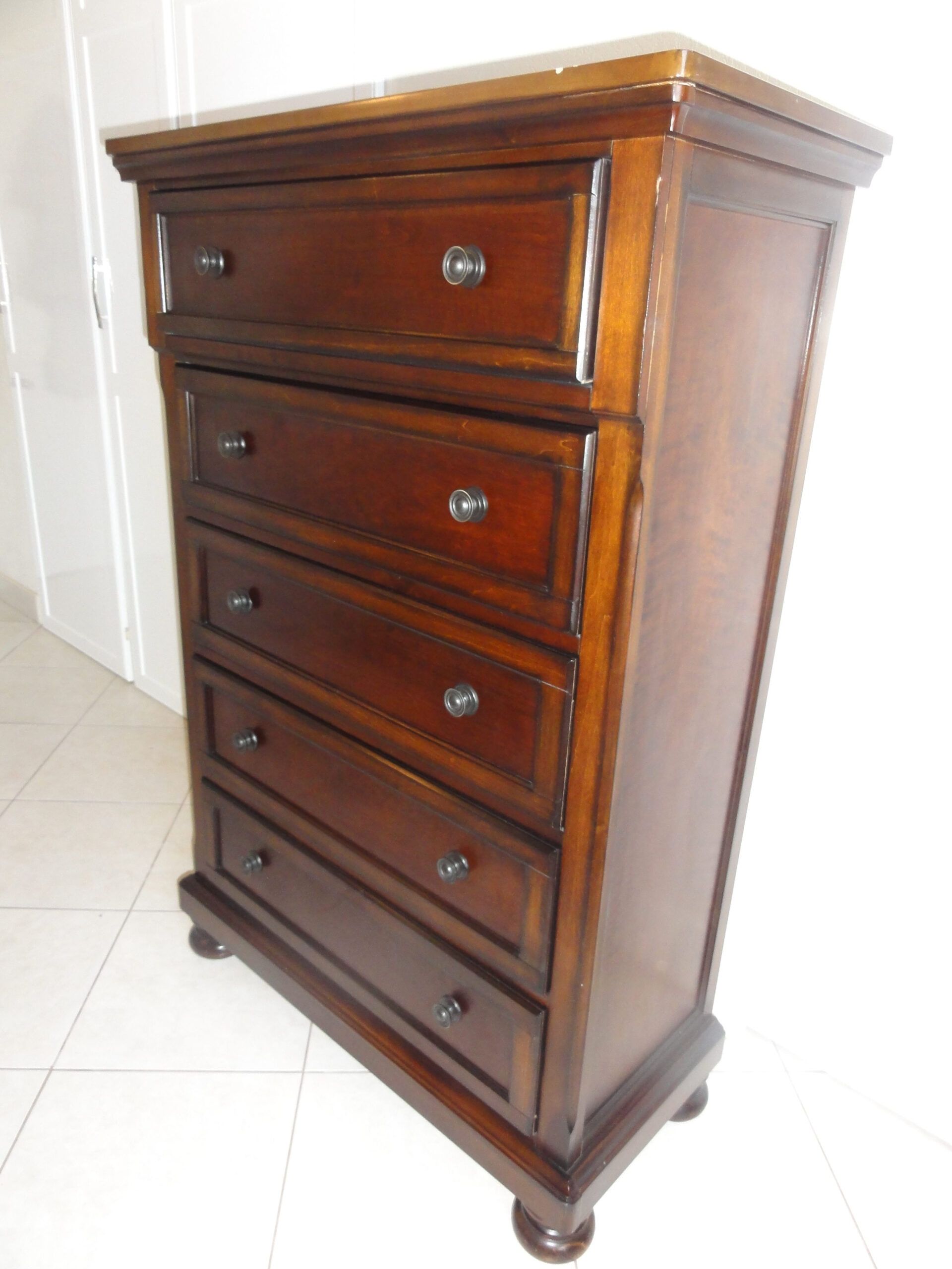 Ashley Millennium Cherry Finish 5-Drawer Available In Barbados intended for Styling Your Dexter Oak Finish 5-Drawer Chest Effortless Interior Design Ideas