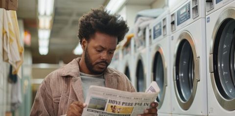 A Man Reading Newspaper In The Laundry Room | Premium Ai-Generated Image pertaining to Beyond the Price Tag What the $4,100 Reader Laundry Room Offers Wisconsin