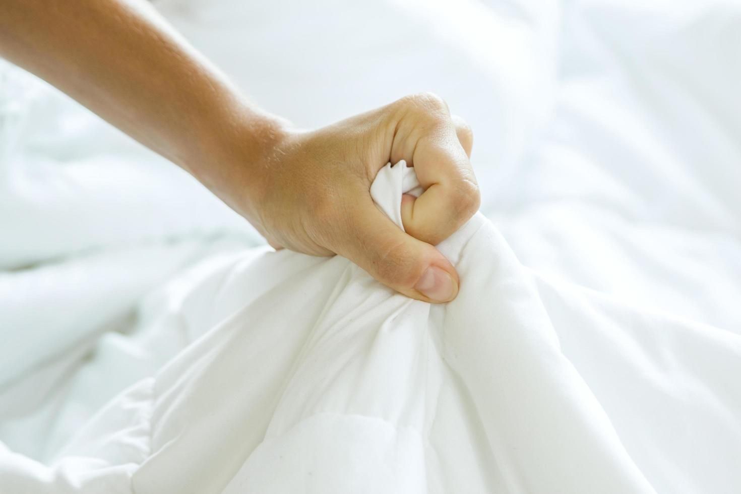 Female Strong Hand Squeezing White Bed Sheet 14400624 Stock Photo At ... for Tips For Squeezing In More Guest Beds