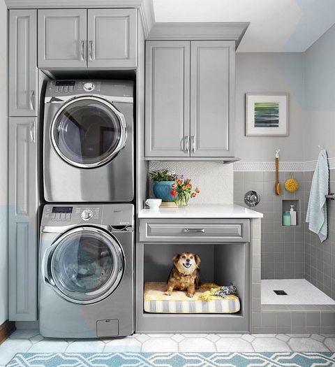 Laundry Room With Stacked Washer/Dryer, A Built-In Dog Bed And A Dog ... intended for Creating the Perfect Laundry Sanctuary for Dog Lovers